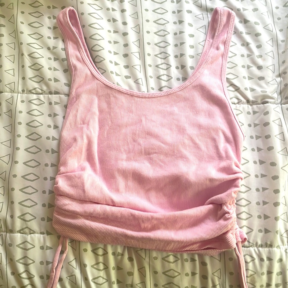 Light pink ribbed tank top with adjustable scrunch sides